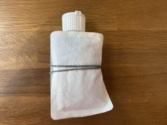 handwarmer attached to urine bottle